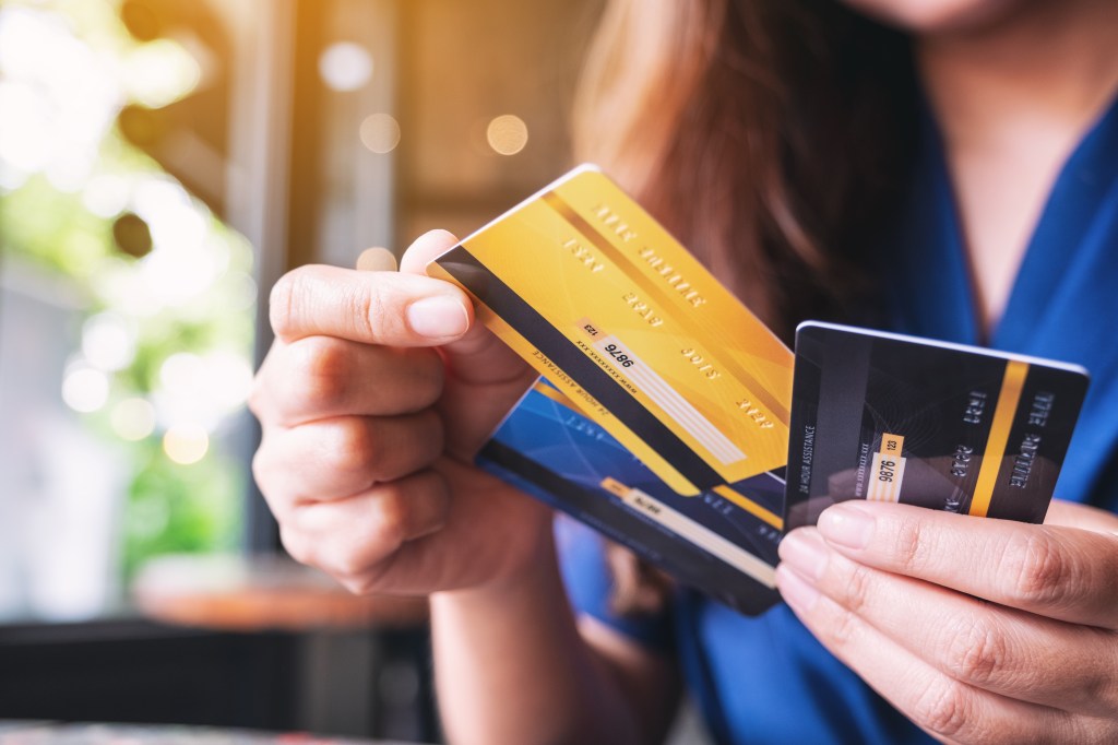 Woman choosing a credit card.